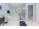 Bathroom featuring a tub, separate glass shower and window that provides natural light at 10322 Stoneykirk Ln, Charlotte, NC 28269