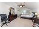 Bright bedroom with a ceiling fan and a large window providing natural light at 10322 Stoneykirk Ln, Charlotte, NC 28269