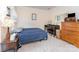 Cozy bedroom with vintage piano, and antique decorations at 10322 Stoneykirk Ln, Charlotte, NC 28269