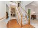 Welcoming foyer with hardwood floors, staircase, and view into the living room at 10322 Stoneykirk Ln, Charlotte, NC 28269