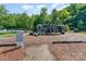 Community playground with slides, climbing structures, and a safety-conscious design at 10322 Stoneykirk Ln, Charlotte, NC 28269