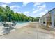 Community pool with tables and chairs, offering a relaxing retreat in a charming outdoor setting at 10322 Stoneykirk Ln, Charlotte, NC 28269