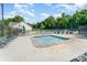 Community pool area with lounge chairs, shaded seating, and a wading pool at 10322 Stoneykirk Ln, Charlotte, NC 28269