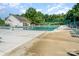 Large community pool with plenty of lounge chairs and a lifeguard stand, perfect for relaxing on sunny days at 10322 Stoneykirk Ln, Charlotte, NC 28269