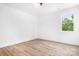 Bright bedroom with hardwood flooring and a large window at 104 Arbor Dr, Waxhaw, NC 28173