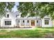 Charming two-story home with a large, inviting front porch and well-manicured lawn at 104 Arbor Dr, Waxhaw, NC 28173