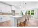 Spacious kitchen with a large island, white cabinets, and stainless steel appliances, perfect for entertaining at 104 Arbor Dr, Waxhaw, NC 28173