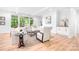 Bright and airy living room featuring a modern fireplace, hardwood floors, and large windows at 104 Arbor Dr, Waxhaw, NC 28173