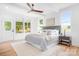 Bright main bedroom with hardwood floors, ceiling fan, and plenty of natural light at 104 Arbor Dr, Waxhaw, NC 28173