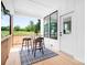 Cozy front porch with seating, wooden floors, and view of the surrounding landscape at 104 Arbor Dr, Waxhaw, NC 28173