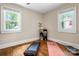 Versatile room with hardwood floors and ample natural light, perfect for a bedroom or home gym with space for fitness equipment at 108 Greenwood Ave, Belmont, NC 28012
