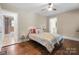 Cozy bedroom featuring hardwood floors and two access doors at 108 Greenwood Ave, Belmont, NC 28012