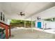 Spacious covered patio with ceiling fans offers an ideal outdoor entertainment area with view of storage shed at 108 Greenwood Ave, Belmont, NC 28012