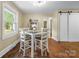 Cozy dining room with stylish chairs, a square table, and natural light, creating a welcoming space for meals and gatherings at 108 Greenwood Ave, Belmont, NC 28012