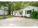 Quaint white house with green shutters, basketball hoop, and a well-maintained front yard at 108 Greenwood Ave, Belmont, NC 28012