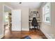 Home office setup featuring a dedicated workspace, comfortable chair, and bright natural light, ideal for productivity and focus at 108 Greenwood Ave, Belmont, NC 28012