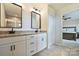 Bathroom featuring dual sinks with granite countertops and tiled shower at 11101 Crane Creek Dr, Charlotte, NC 28278