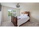Bedroom featuring neutral walls, carpet, and a window with a view of the outdoors at 11101 Crane Creek Dr, Charlotte, NC 28278