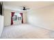 Spacious bedroom with a ceiling fan, neutral walls, plush carpet, and bright natural light at 11101 Crane Creek Dr, Charlotte, NC 28278
