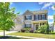 Charming two-story home featuring well-manicured lawn, attached garage and beautiful landscaping at 11101 Crane Creek Dr, Charlotte, NC 28278