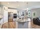 Open kitchen featuring stainless appliances, granite counters, an island and an eat-in kitchen at 11101 Crane Creek Dr, Charlotte, NC 28278