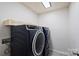 Modern laundry room showcasing side-by-side washer and dryer units, optimized for efficient laundry tasks at 11101 Crane Creek Dr, Charlotte, NC 28278