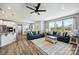 Inviting living room with natural light and an open layout connecting dining area and kitchen at 11101 Crane Creek Dr, Charlotte, NC 28278