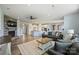 Expansive open floor plan with a stone fireplace, living area, and a connected kitchen at 11101 Crane Creek Dr, Charlotte, NC 28278