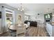 Open concept dining area, view to the living area, a table with seating for four people at 11101 Crane Creek Dr, Charlotte, NC 28278