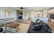 Open-concept living room featuring a stone fireplace and seamless flow to the kitchen at 11101 Crane Creek Dr, Charlotte, NC 28278