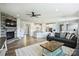 Bright, open floor plan with stone fireplace, living space, and kitchen at 11101 Crane Creek Dr, Charlotte, NC 28278