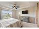 Bedroom featuring a tray ceiling, ceiling fan, neutral walls, carpet and ensuite bathroom at 11101 Crane Creek Dr, Charlotte, NC 28278