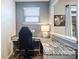 Office space with granite countertops, modern decor, and natural light from the window at 11101 Crane Creek Dr, Charlotte, NC 28278