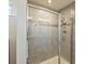 Large glass enclosed shower with grey tile and accent border at 11101 Crane Creek Dr, Charlotte, NC 28278