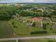 An aerial view of homes with trees, green lawns and a nearby park with a lake at 1111 Lizzie Ln, Salisbury, NC 28147