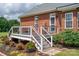 Spacious back deck with decorative white rails and multiple levels overlooking lush landscaping at 1111 Lizzie Ln, Salisbury, NC 28147