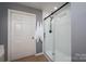 Bathroom featuring a glass enclosed shower, modern fixtures, and tile flooring at 1111 Lizzie Ln, Salisbury, NC 28147