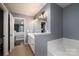 Bright bathroom with double sink vanity, soaking tub and access to the Primary bedroom at 1111 Lizzie Ln, Salisbury, NC 28147