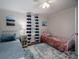 Bright bedroom featuring twin beds with striped curtains and accent decor at 1111 Lizzie Ln, Salisbury, NC 28147