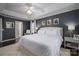 Primary bedroom with a tray ceiling, neutral walls, a ceiling fan, and a decorative rug at 1111 Lizzie Ln, Salisbury, NC 28147