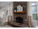Living room fireplace featuring a stone surround, mantel, and decorative accents at 1111 Lizzie Ln, Salisbury, NC 28147