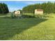 A vibrant garden showcases fresh produce with lush greenery and a tool shed at 1111 Lizzie Ln, Salisbury, NC 28147