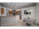 Kitchen and dining area showcasing stainless steel appliances and an adjacent dining space with tile flooring at 1111 Lizzie Ln, Salisbury, NC 28147