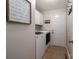 Functional laundry room with washer, dryer, cabinetry, and access to the exterior at 1111 Lizzie Ln, Salisbury, NC 28147