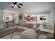 Open-concept living room boasts a large sectional couch, ceiling fan, and views to the kitchen and dining areas at 1111 Lizzie Ln, Salisbury, NC 28147