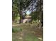 Spacious backyard featuring a patio with an umbrella table and chairs, as well as a swing set for leisure at 11718 Battery Pl, Charlotte, NC 28273