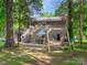 Enjoy backyard views, complete with a swing and outdoor seating for relaxing evenings at 11718 Battery Pl, Charlotte, NC 28273