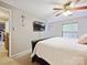 Bedroom featuring a ceiling fan, carpeted floor, and a wall-mounted television at 11718 Battery Pl, Charlotte, NC 28273