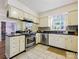 A kitchen featuring stainless steel appliances, granite countertops, and tile flooring at 11718 Battery Pl, Charlotte, NC 28273