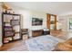 Comfortable living room with hardwood floors, a brick fireplace, and modern decor for cozy living at 11718 Battery Pl, Charlotte, NC 28273